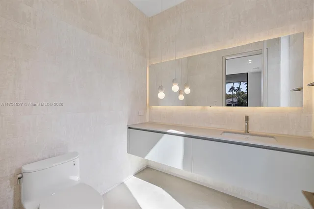 a view of an empty room with windows