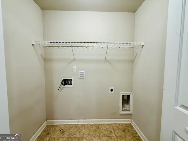 a view of a chairs and table in the patio