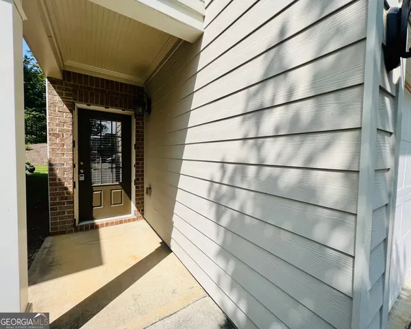 a view of a glass door with an empty room