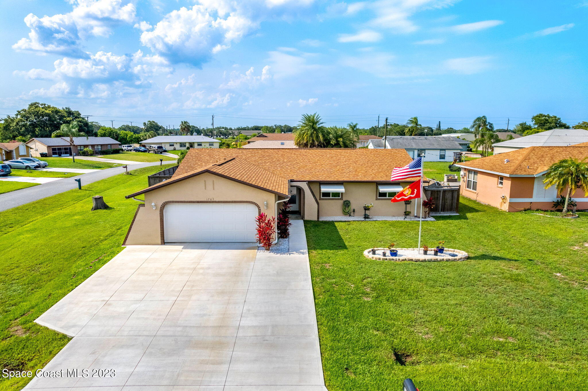 1705 Brookside Street Northeast Palm Bay, FL 32907 - Photo 1 of 24 a view of a house with a big yard