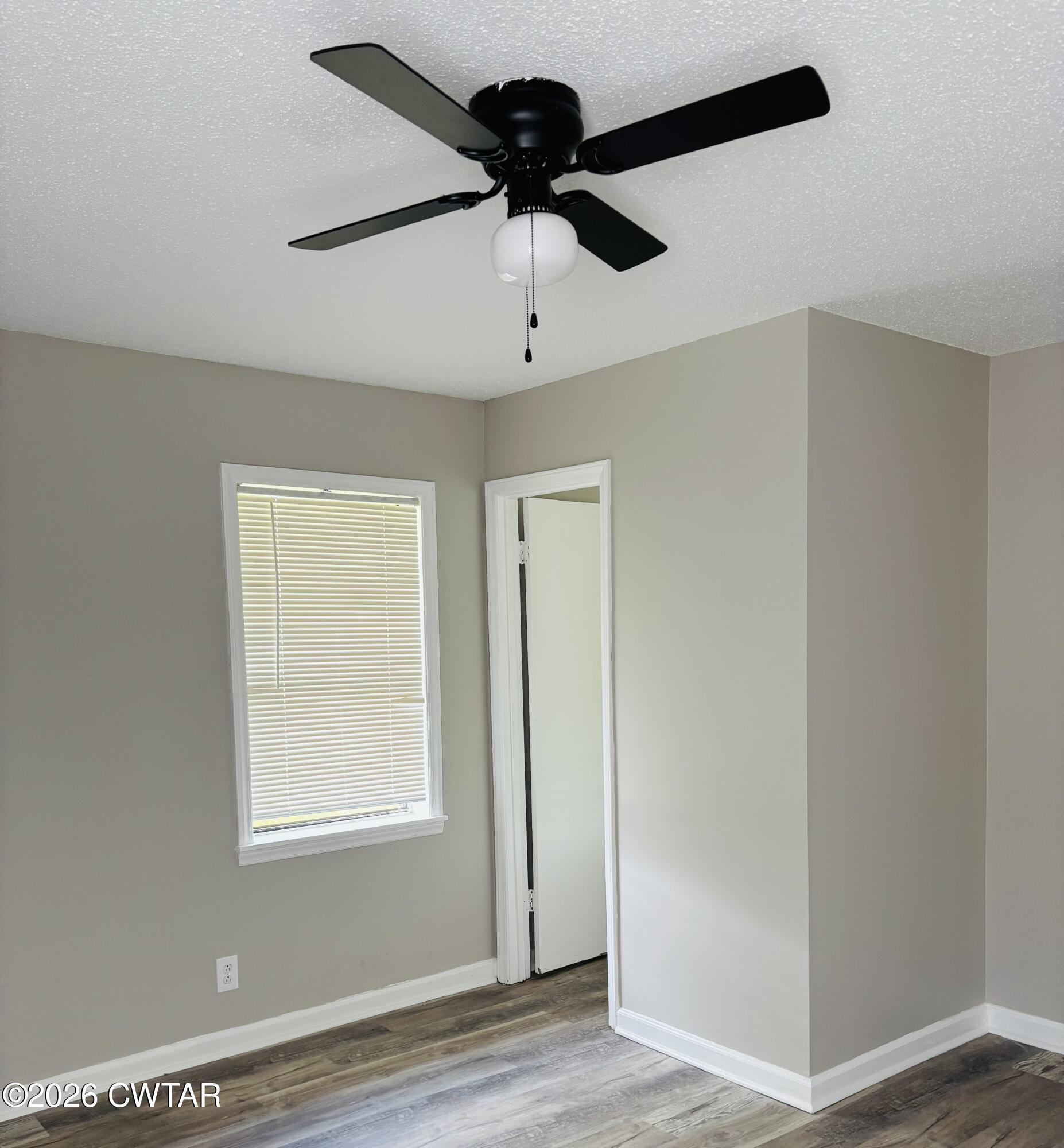 149 Commanche Trail Jackson, TN 38305 - Photo 10 of 15 a view of empty room with wooden floor