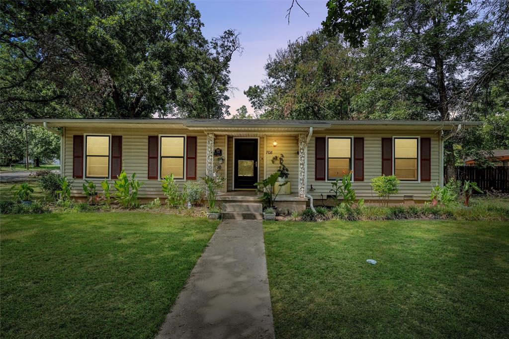 708 Triangle Place Waco, TX 76710 - Photo 1 of 1 a front view of house with yard and green space