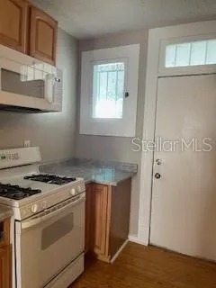 a kitchen with a stove and a refrigerator
