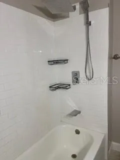 a bathroom with a bath tub