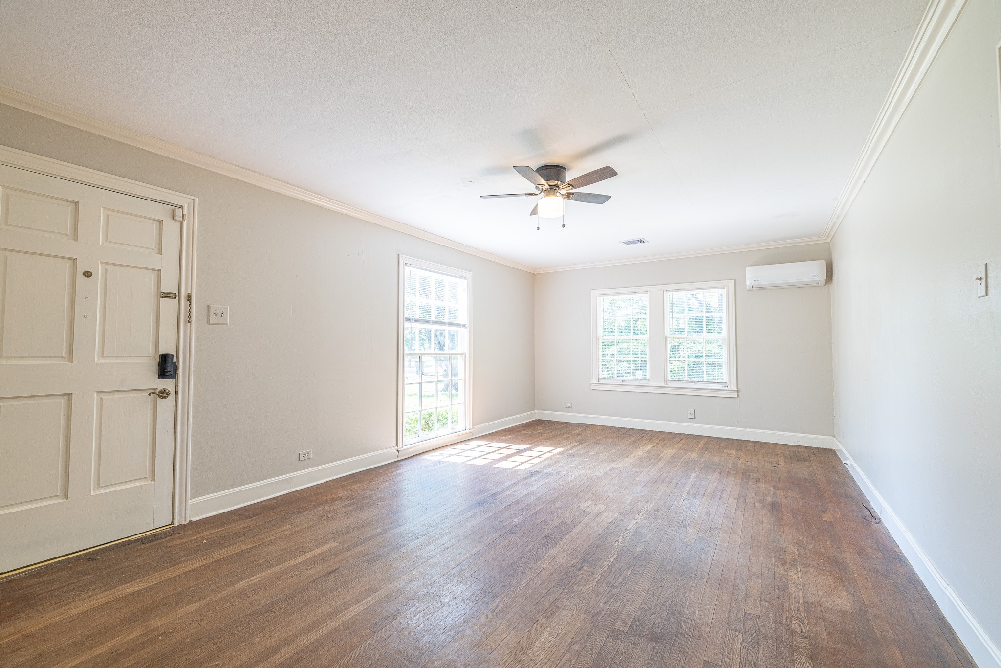 8548 Findlay Street Houston, TX 77017 - Photo 7 of 50 a view of an empty room with a window and wooden floor
