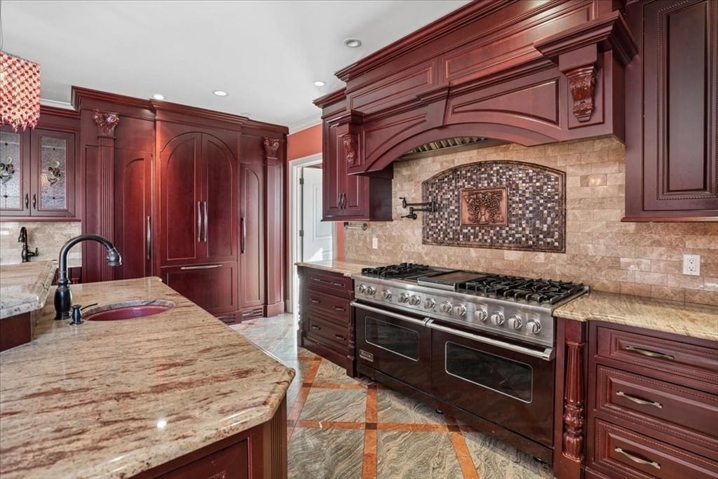 3 Regency Ridge Andover, MA 01810 - Photo 12 of 40 a kitchen with stainless steel appliances granite countertop a stove and a sink