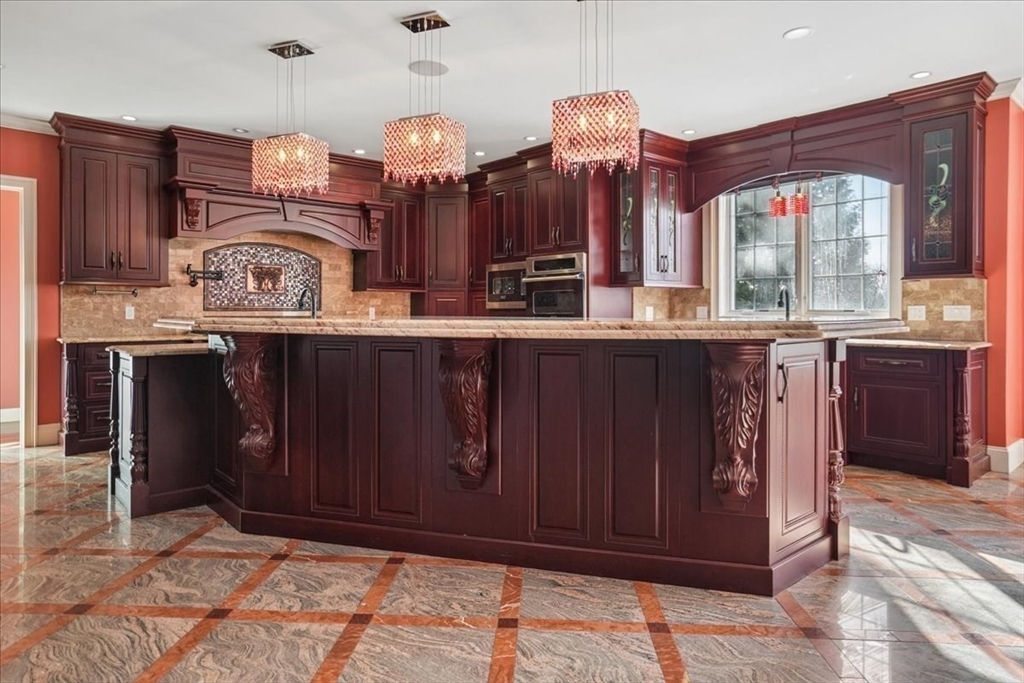 3 Regency Ridge Andover, MA 01810 - Photo 13 of 40 a kitchen with lots of counter space and windows