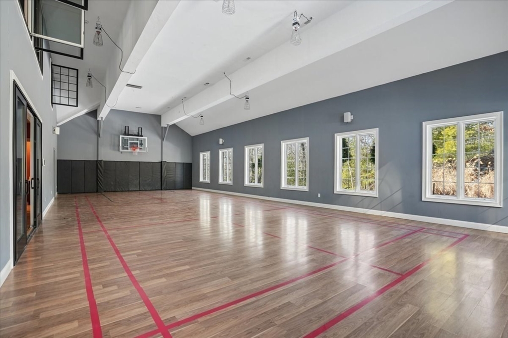 3 Regency Ridge Andover, MA 01810 - Photo 15 of 40 a view of an empty room with wooden floor and a window