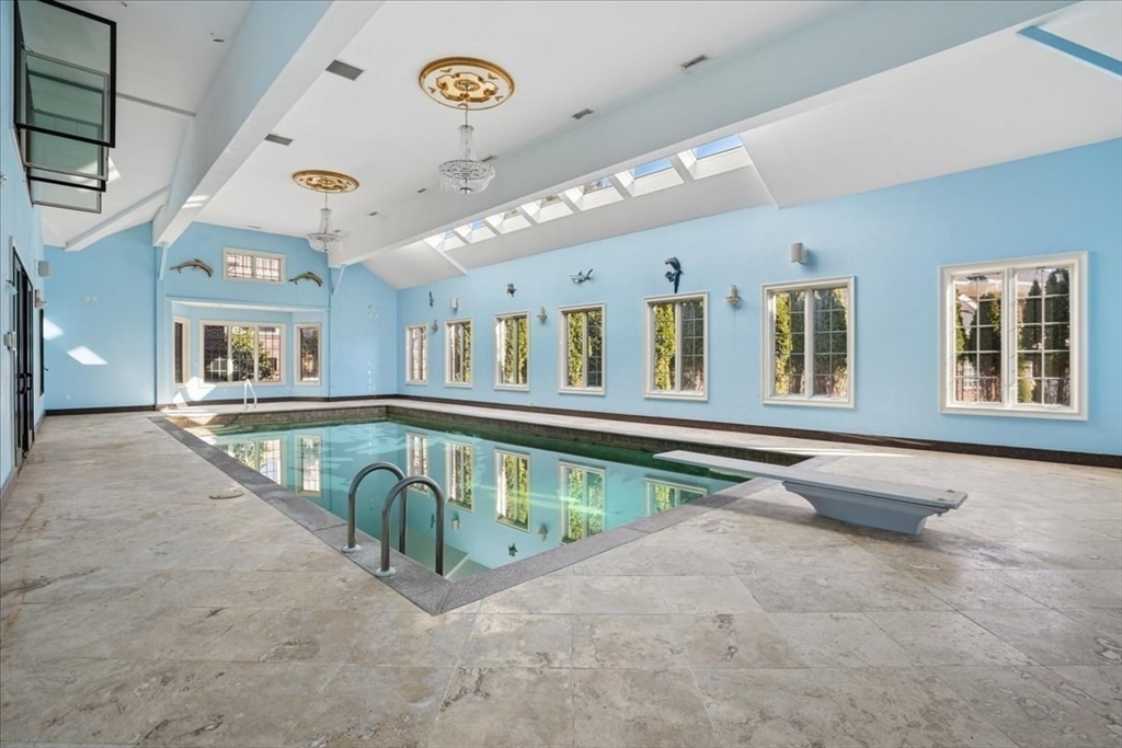 3 Regency Ridge Andover, MA 01810 - Photo 17 of 40 a swimming pool with outdoor seating