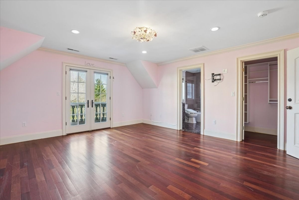 3 Regency Ridge Andover, MA 01810 - Photo 20 of 40 a view of an empty room with wooden floor and a window
