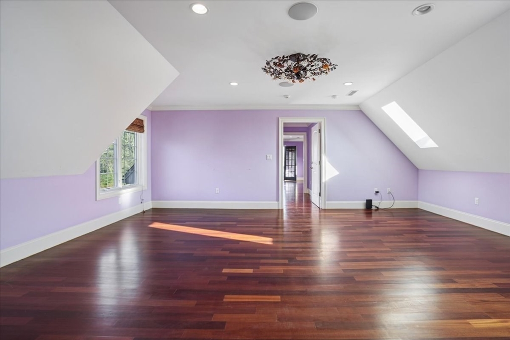 3 Regency Ridge Andover, MA 01810 - Photo 21 of 40 a view of an empty room with wooden floor