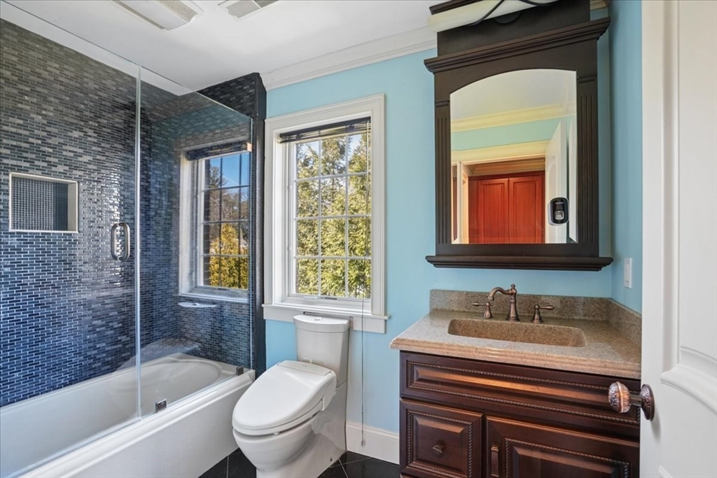 3 Regency Ridge Andover, MA 01810 - Photo 25 of 40 a bathroom with a sink a toilet and shower