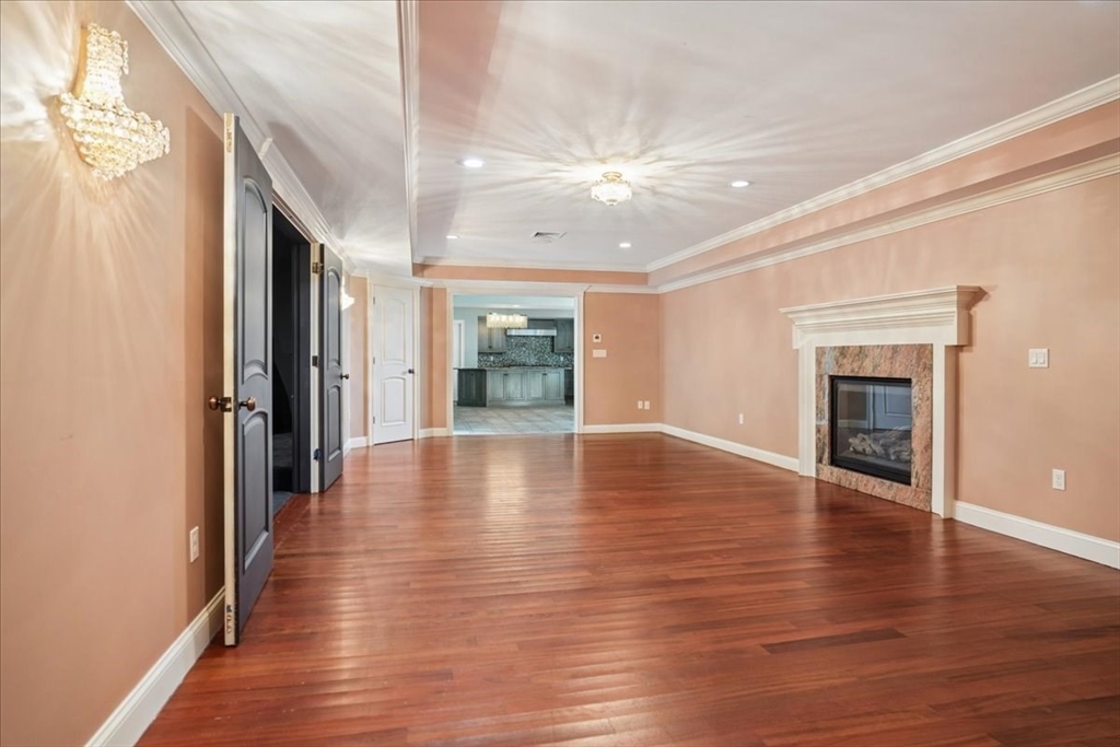 3 Regency Ridge Andover, MA 01810 - Photo 34 of 40 a view of an empty room with wooden floor and a window