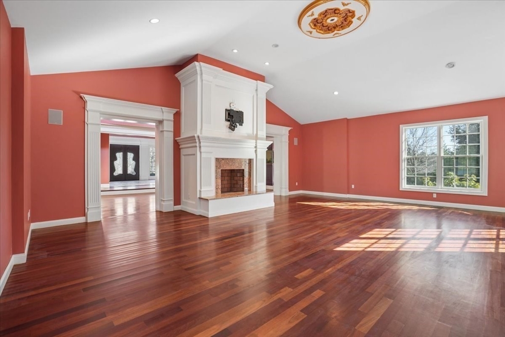 3 Regency Ridge Andover, MA 01810 - Photo 8 of 40 a view of an empty room with window wooden floor and a kitchen