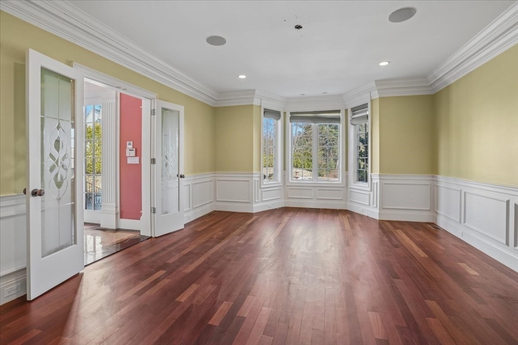 3 Regency Ridge Andover, MA 01810 - Photo 9 of 40 a view of an empty room with wooden floor and a window