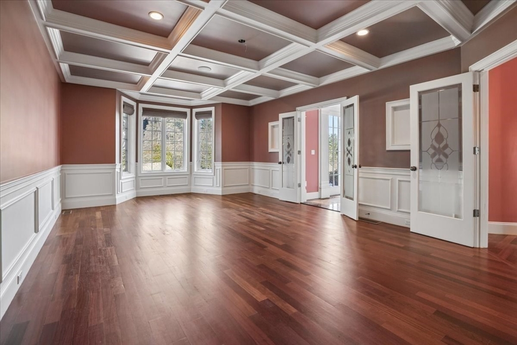 3 Regency Ridge Andover, MA 01810 - Photo 10 of 40 an empty room with wooden floor and windows