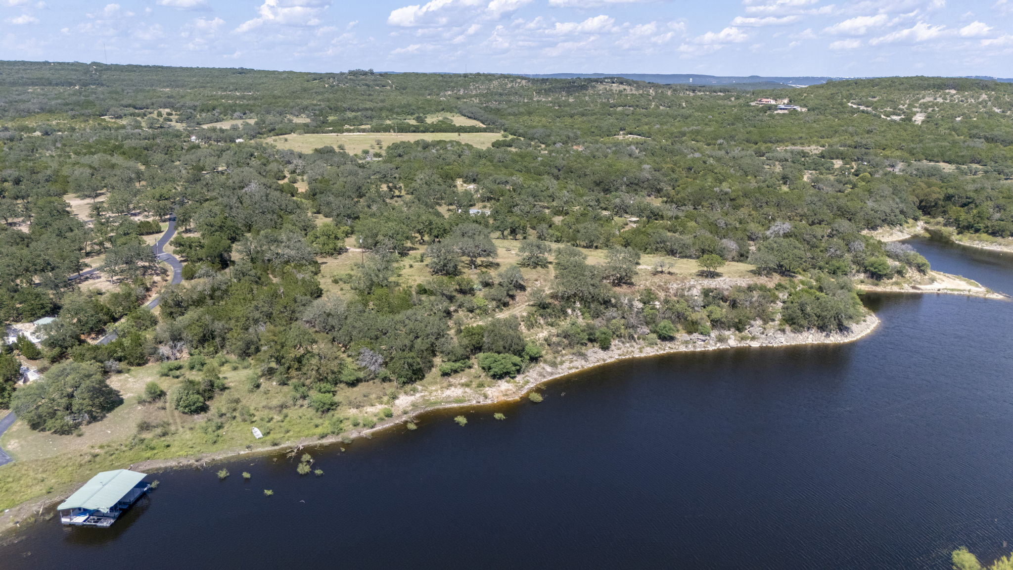 Tbd Singleton Road Marble Falls, TX 78654 - Photo 12 of 40 Drone / aerial view of the immediate area with Lake Travis and woods