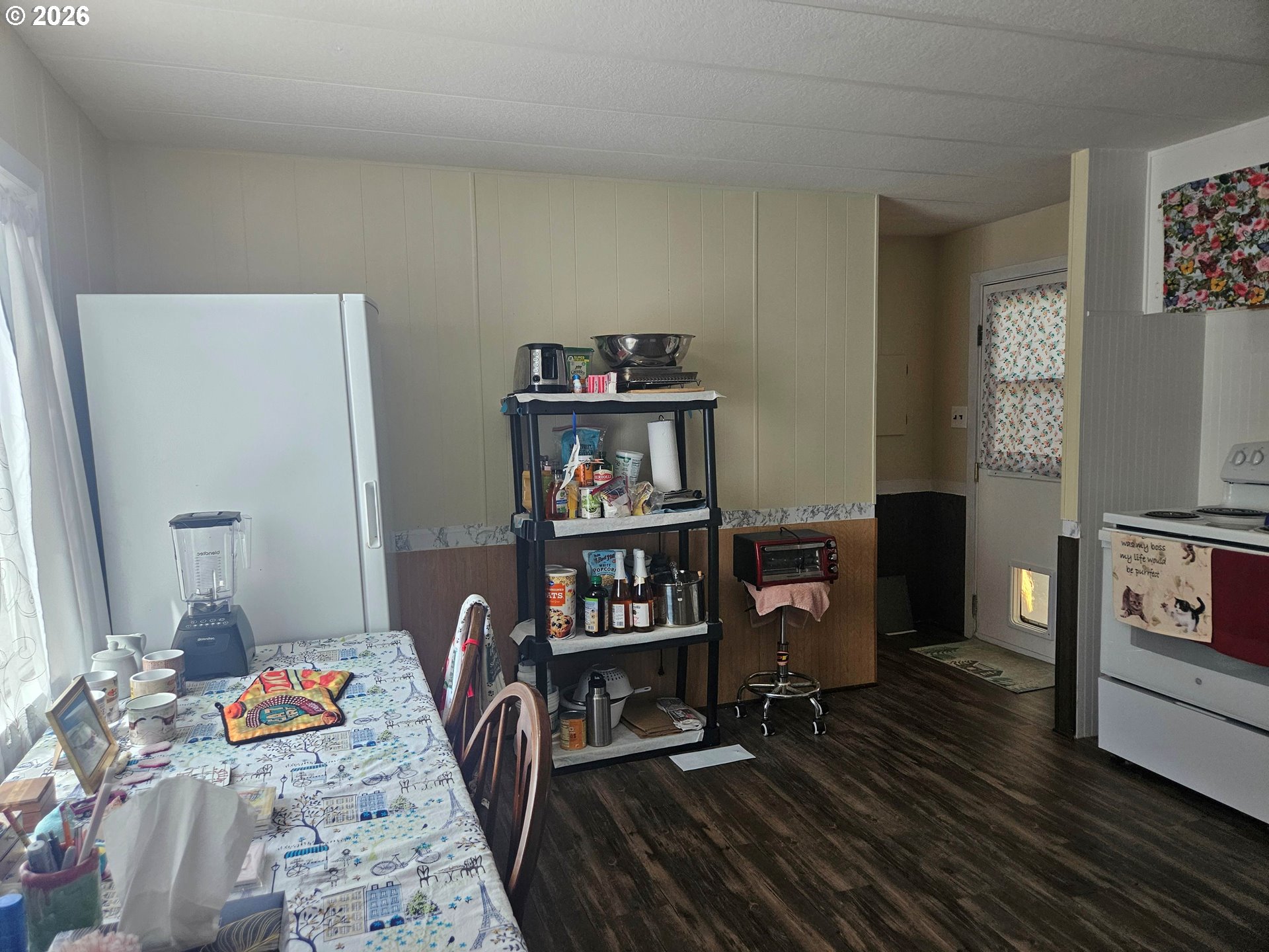 1600 Rhododendron Drive, Unit 214 Florence, OR 97439 - Photo 10 of 38 a bedroom with furniture and a book shelf