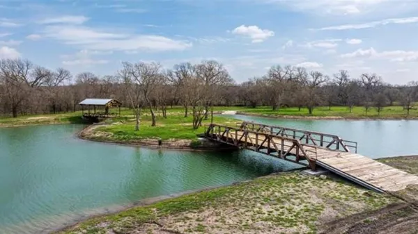a view of a lake with a yard