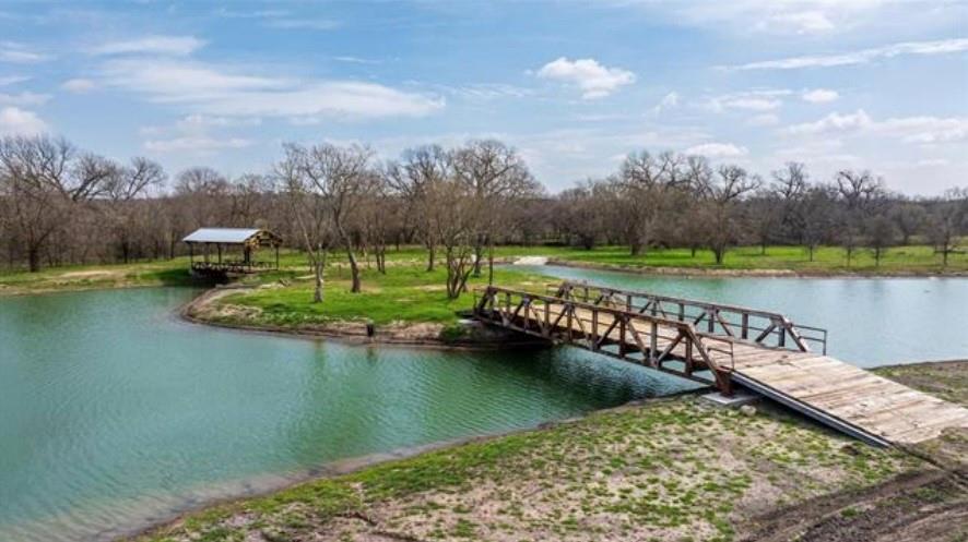 a view of a lake with a yard