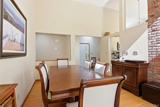 a dining room with furniture and wooden floor