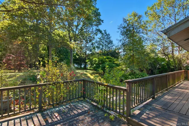 a view of a balcony with wooden floor