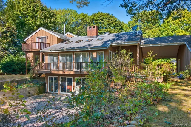 a front view of house with a garden