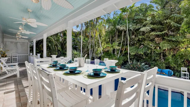 a view of an outside dining space with furniture