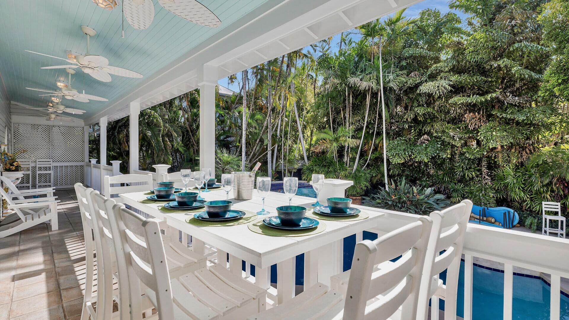 326 Caroline Street Key West, FL 33040 - Photo 12 of 47 a view of an outside dining space with furniture