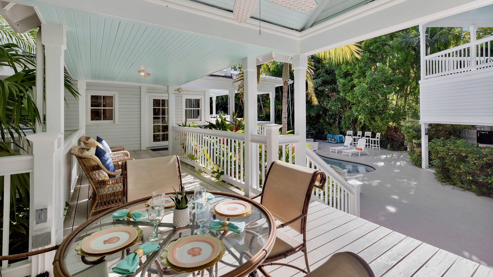 326 Caroline Street Key West, FL 33040 - Photo 13 of 47 a outdoor space with furniture and garden view