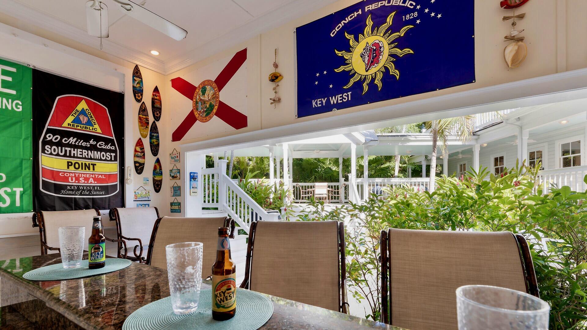 326 Caroline Street Key West, FL 33040 - Photo 15 of 47 a view of an chairs and tables in patio