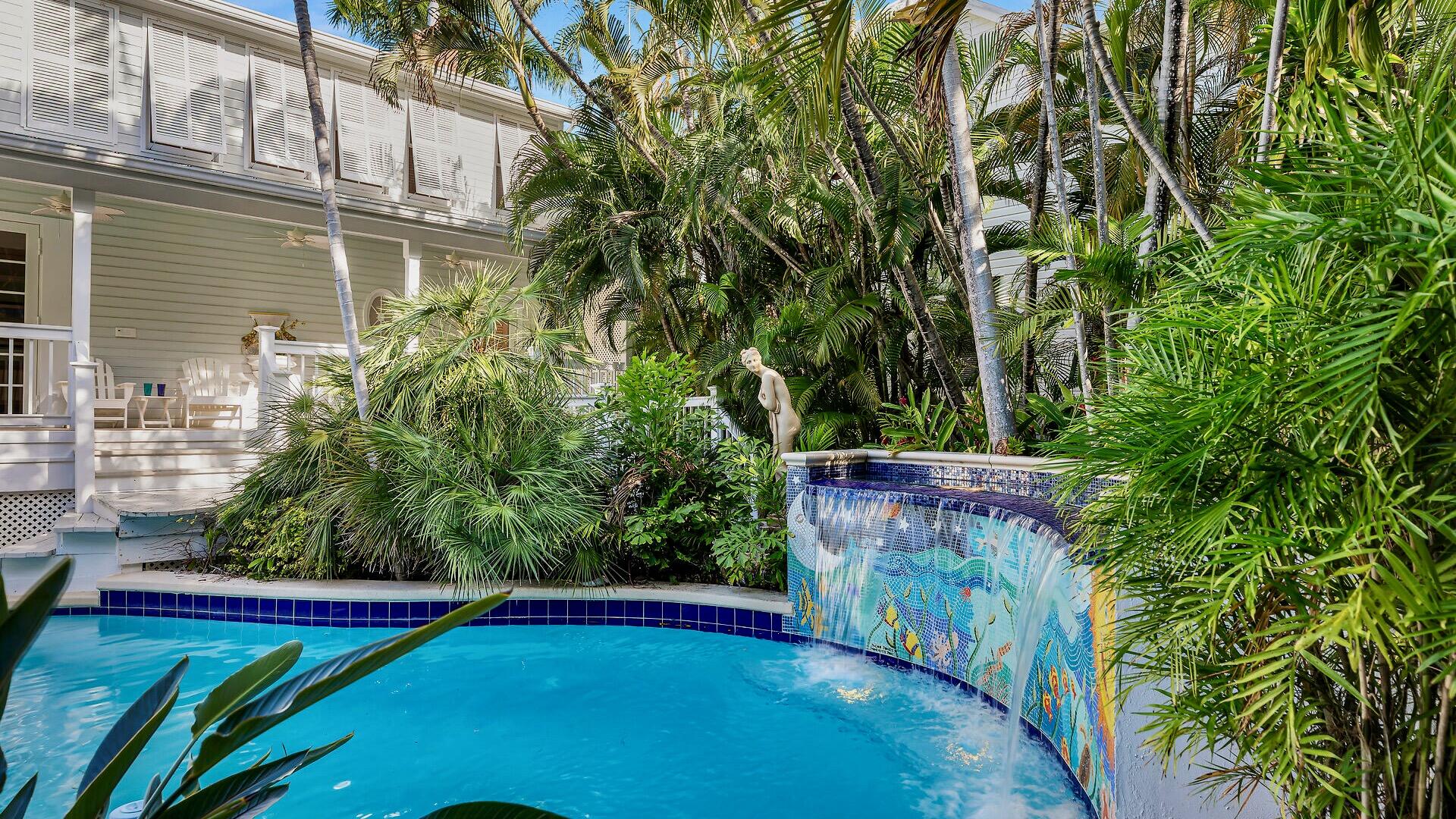 326 Caroline Street Key West, FL 33040 - Photo 16 of 47 an outdoor space with pool and trees