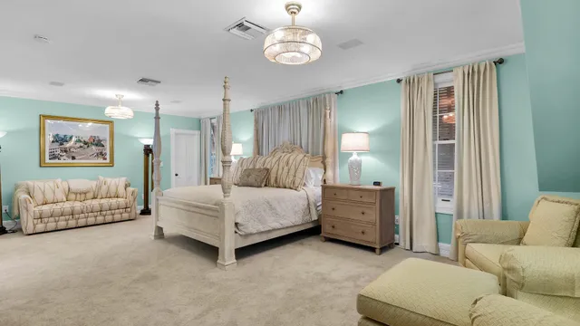 a living room with furniture and a walk in closet