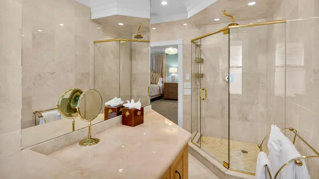 a bathroom with a shower sink and mirror