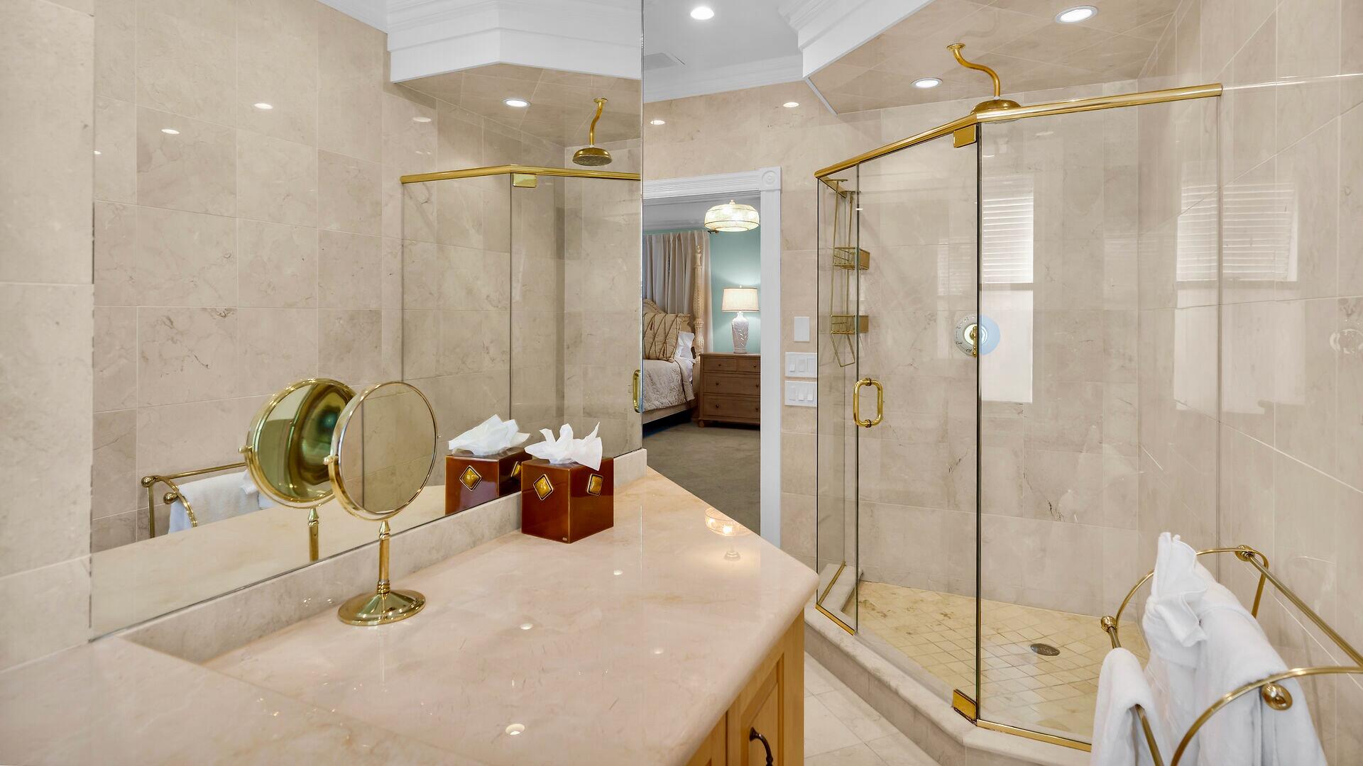 326 Caroline Street Key West, FL 33040 - Photo 25 of 47 a bathroom with a shower sink and mirror