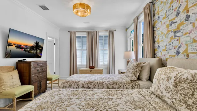 a bedroom with a bed and glass door