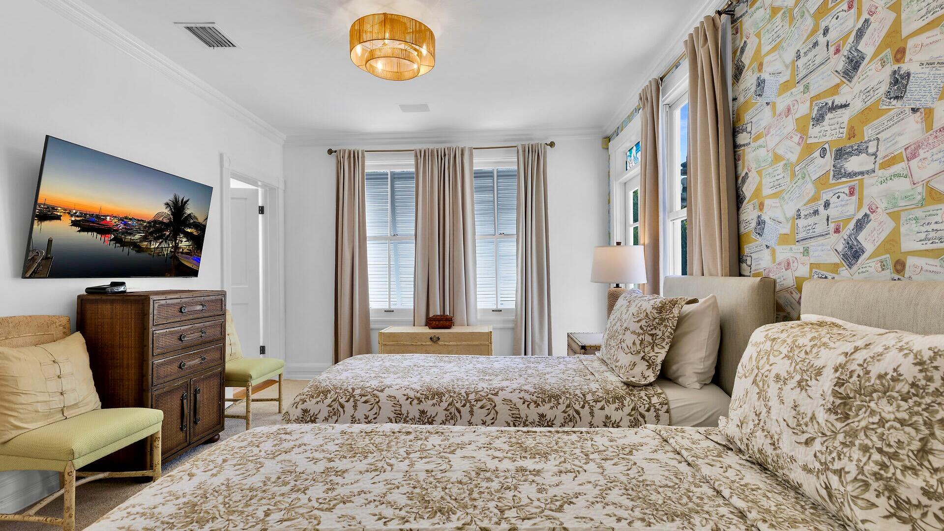 326 Caroline Street Key West, FL 33040 - Photo 26 of 47 a bedroom with a bed and glass door