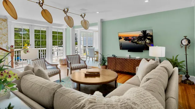 a living room with furniture ceiling fan and a rug
