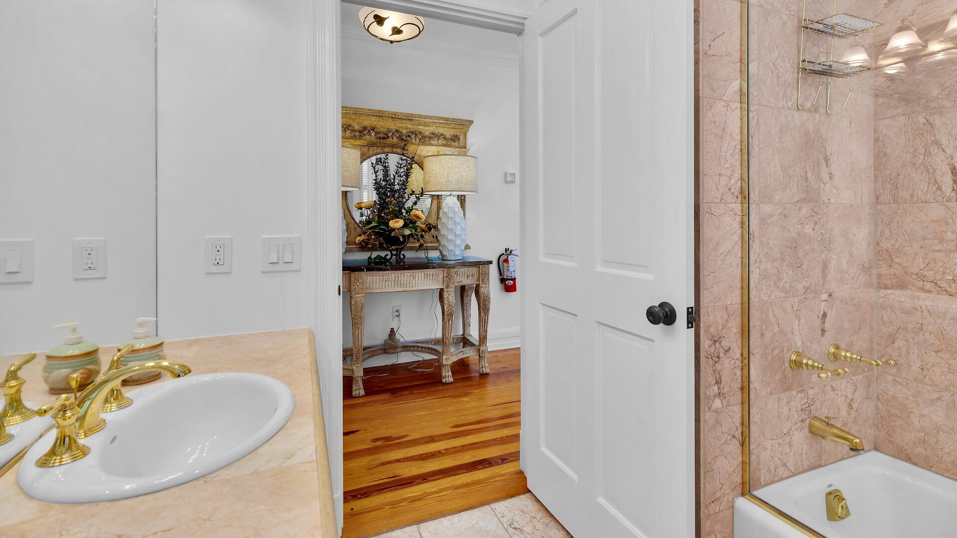 326 Caroline Street Key West, FL 33040 - Photo 33 of 47 a bathroom with a sink and a mirror