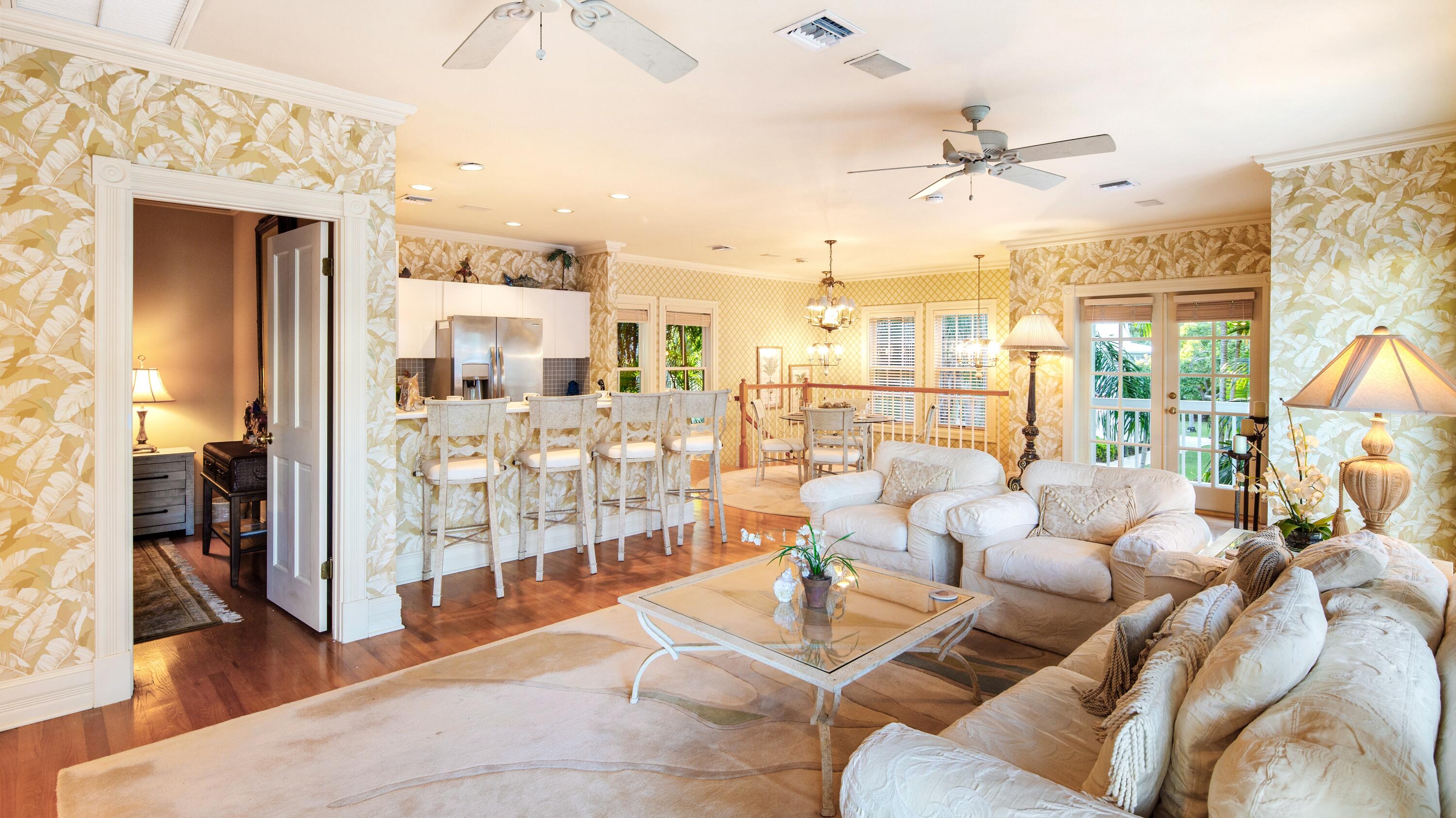 326 Caroline Street Key West, FL 33040 - Photo 35 of 47 a living room with furniture and a chandelier
