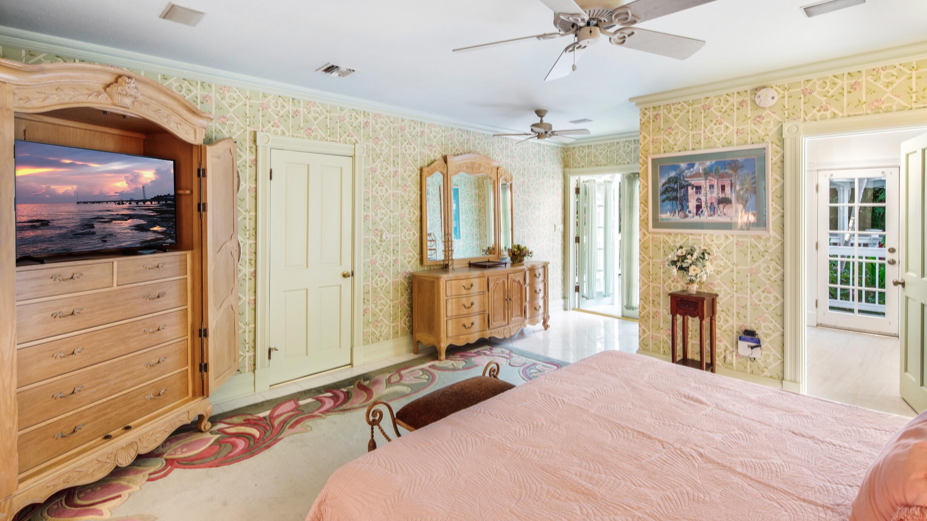 326 Caroline Street Key West, FL 33040 - Photo 43 of 47 a bedroom with a bed and a flat screen tv