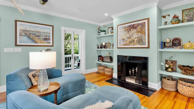 a living room with furniture and a fireplace