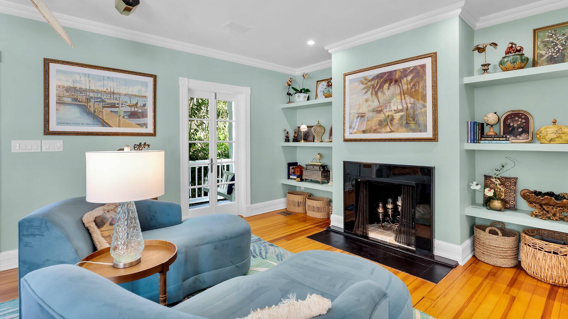 326 Caroline Street Key West, FL 33040 - Photo 5 of 47 a living room with furniture and a fireplace