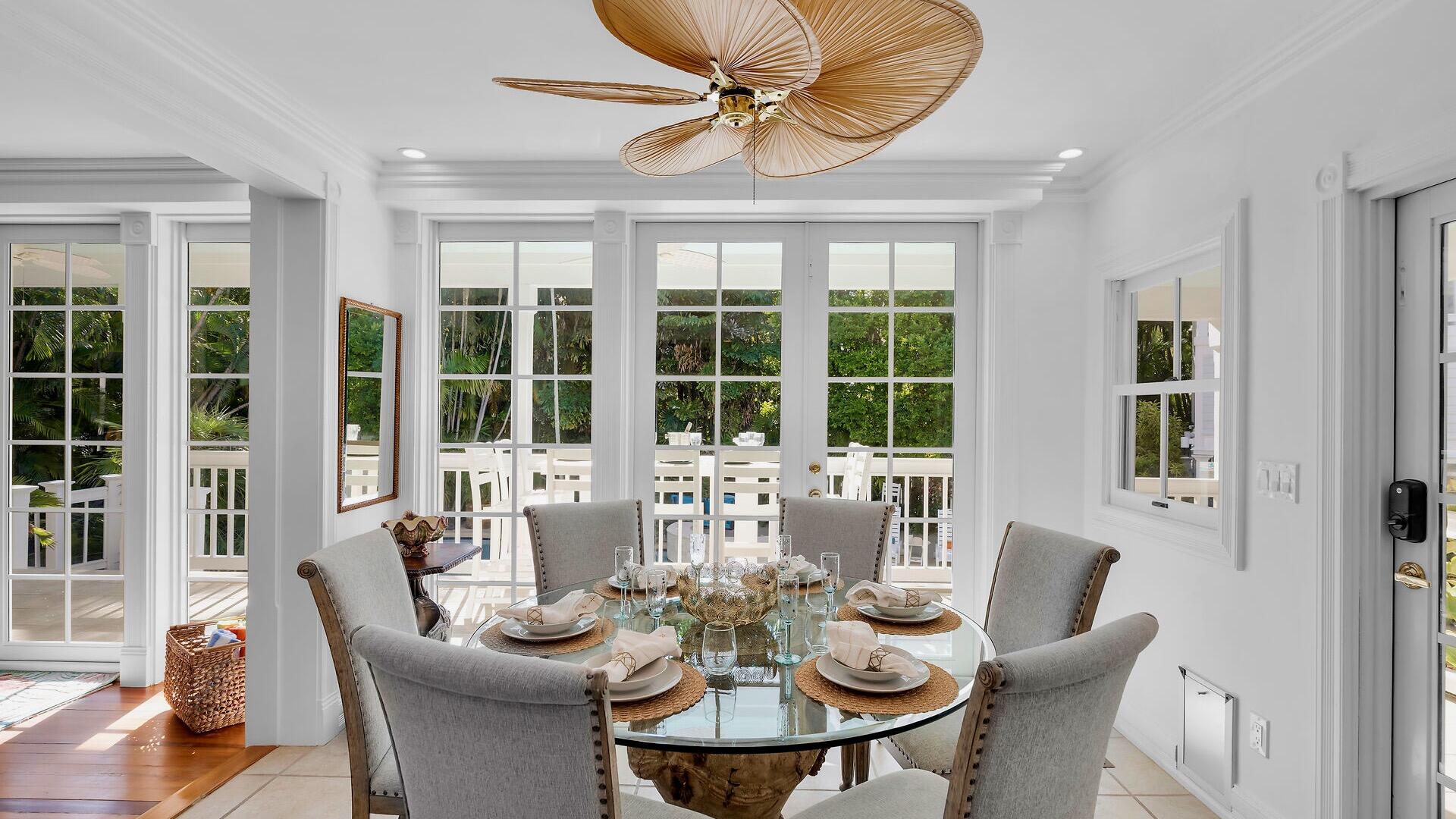 326 Caroline Street Key West, FL 33040 - Photo 8 of 47 a view of a dining room with furniture window and outside view