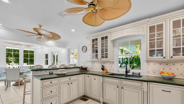 a kitchen with sink cabinets and window