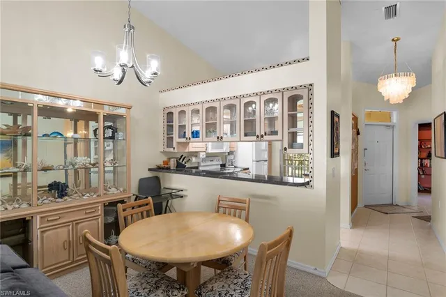 a kitchen with sink and refrigerator