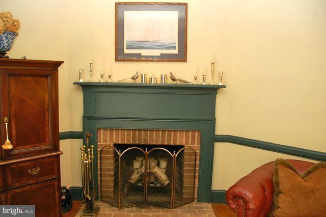 Wood detail and fireplace add to the charm