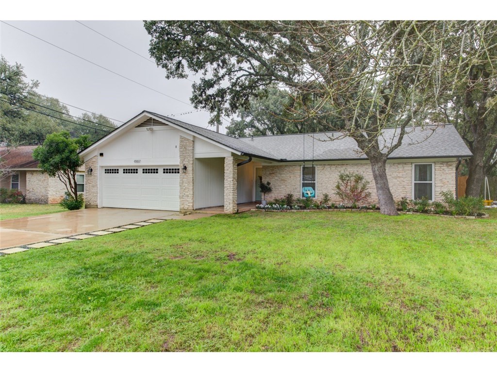 4907 Dry Oak Trail Austin, TX 78749 - Photo 1 of 1 a front view of a house with a yard and trees