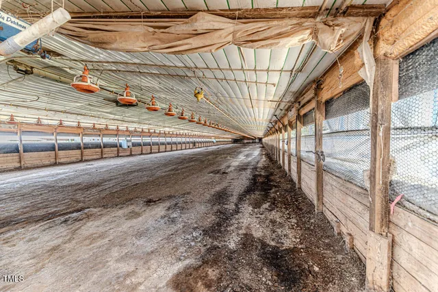 a backyard of a house with yard and outdoor seating