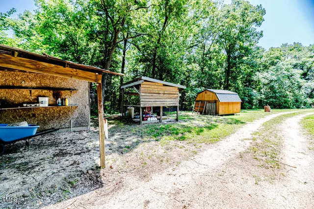 a bench sitting in a room next to a chair